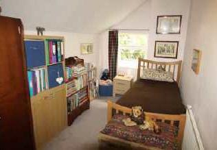 77m (13'7" x 12'4") Having a built-in cupboard with shelving, radiator, access to the loft area, TV and telephone