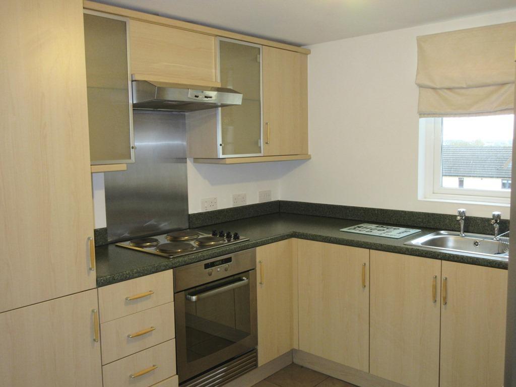Single drainer stainless steel sink unit, inset electric four place hob, electric oven and extractor hood over. Integrated washer/drier and fridge/freezer, ceramic tiled floor and electric radiator.