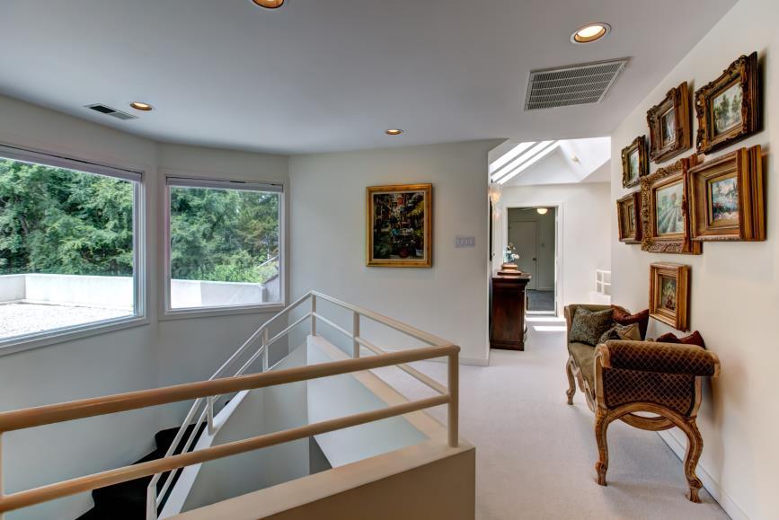 Second Level Upper Hall - Loft Carpet; windows in the stairwell overlook the custom rooftop zen