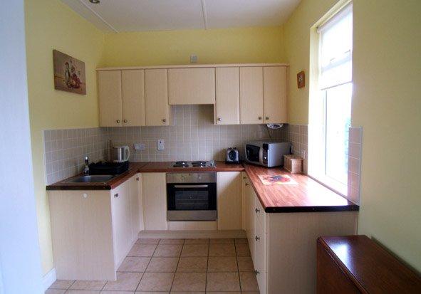 64m ) Attractive units at floor and wall level with integrated hob, oven, fridge and extractor all included in the sale, ceiling spot lights, tiled floor and