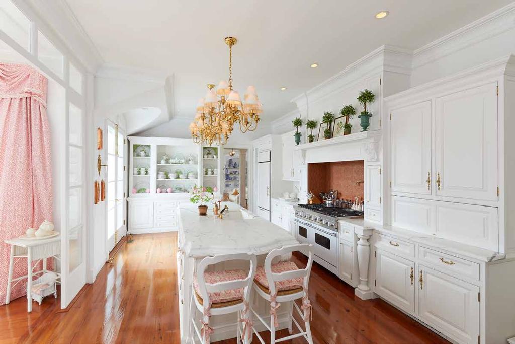 Kitchen The core of the first floor is the charming kitchen with white Carrara marble counters, high-end appliances such as a Viking stove with dual ovens and a Sub-Zero refrigerator, custom-built