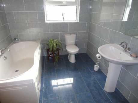 12m) Double glazed window to front aspect, radiator, laminate wood flooring Bathroom Double glazed window to rear aspect, white suite comprising low flush WC, pedestal sink and panel enclosed bath,