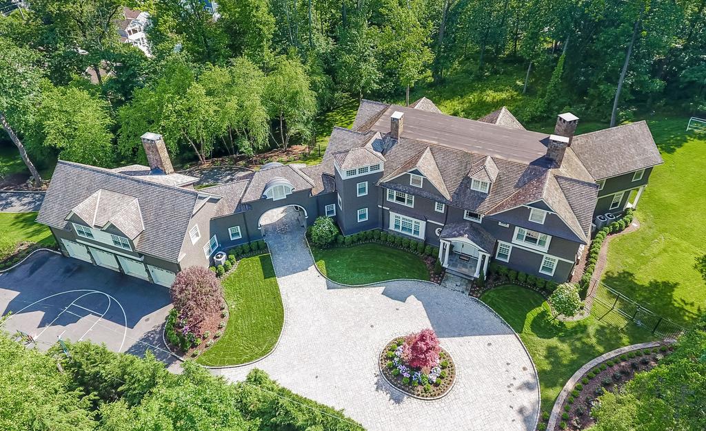 IMPRESSIVE Nestled amid a bevy of grand private estates in the heart of Old Short HIlls, this custom-built stone and