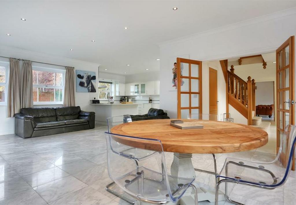 67m) A light and spacious open plan kitchen beautifully appointed with a range of contemporary white fronted base cupboards, working surfaces and matching wall cupboards, quartz granite work