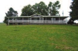 3 bedrooms, 2 baths, 2-1/2 car garage and 40x30 barn. Call for details.