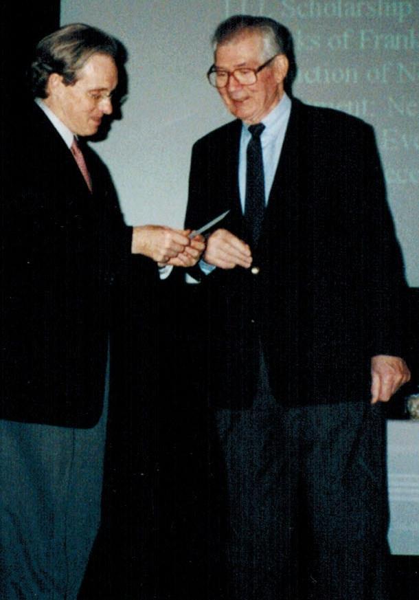 Dr. Donald Moore, awarding Dr.