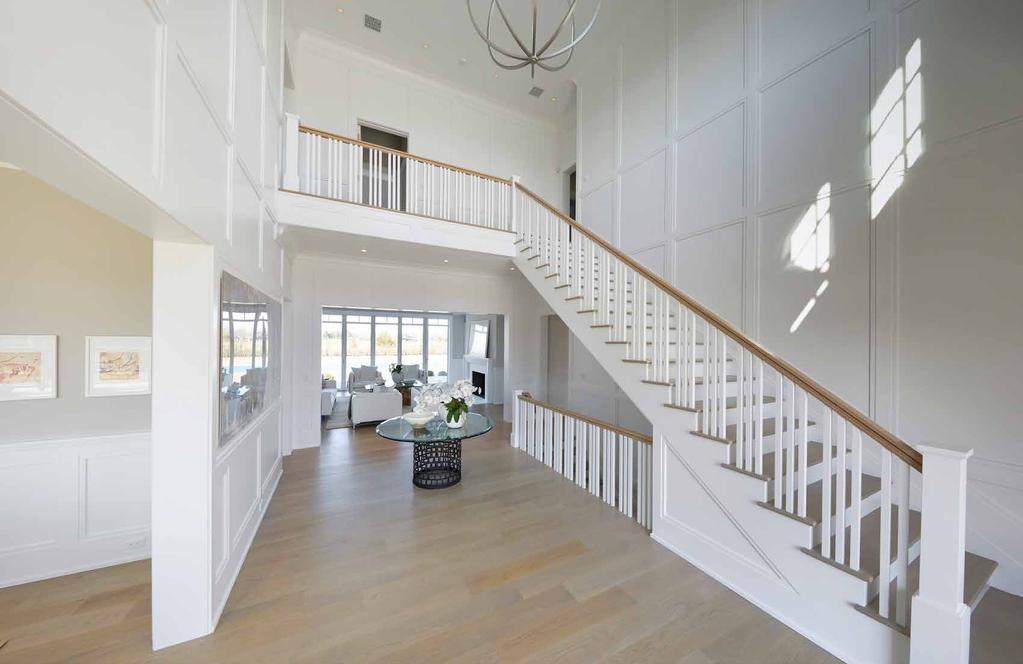 FOYER A gracious double-height foyer gives way to a spacious main level which includes a formal living room, a
