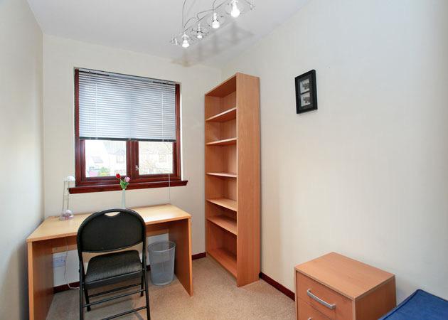 10 5 x 8 7 approx. Additional Double Bedroom to the rear with built-in wardrobe. Light fitment, fitted carpet, curtains.
