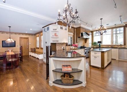 countertops, double undermount stainless steel sinks and an additional prep sink in the breakfast bar, beautiful tumbled stone backsplash, and