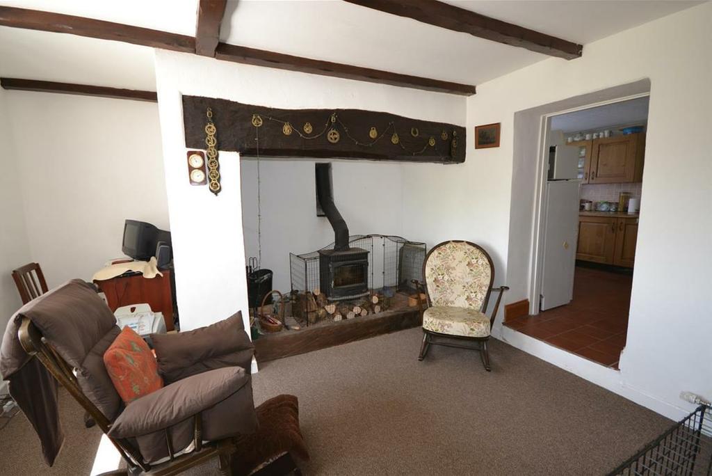 SITTING ROOM 12'9" x 15'8" UPVC double glazed window to front, large inglenook fireplace with multi fuel