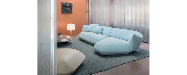 The system comprises a three-seater sofa and a footrest, which can be used independently.