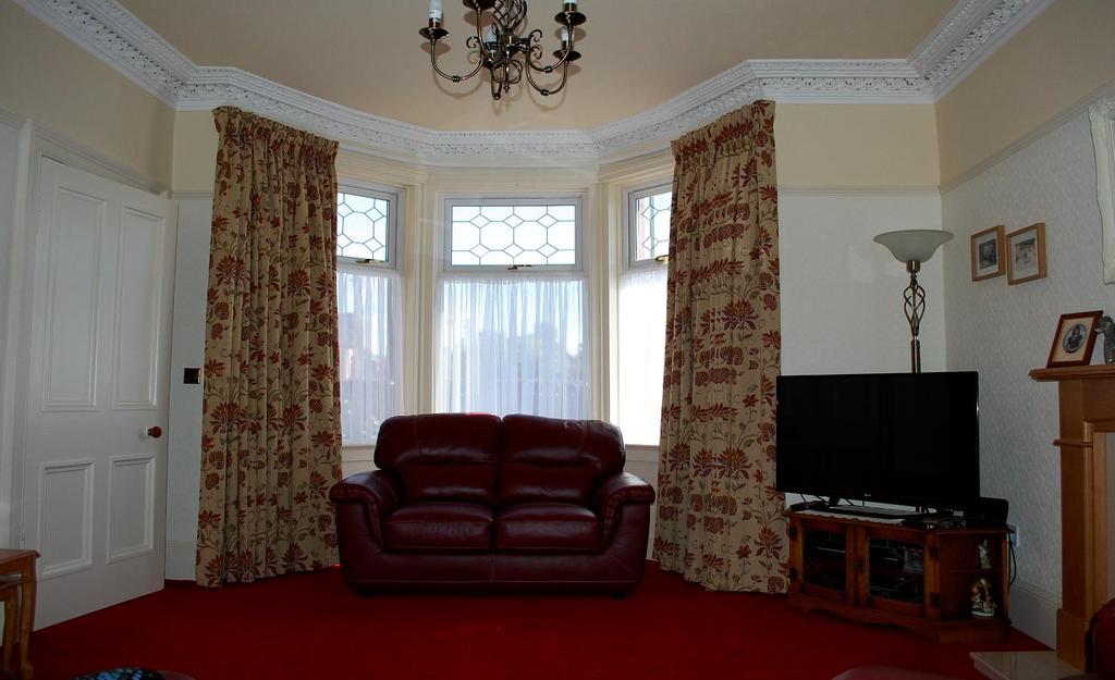 the landing and upstairs accommodation. Lounge: 12 07 x 16 04 (into bay) A spacious room with plenty of original character including a bay window overlooking the front, ornate coving and ceiling rose.