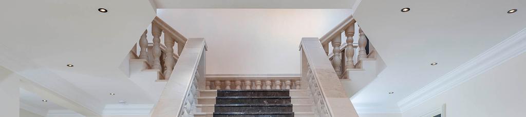 galleried landing surrounding the stairwell with polished marble spindles and hand rail.