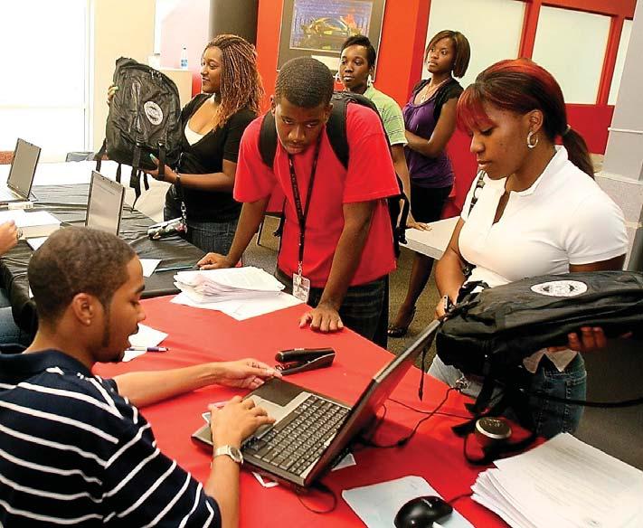 Freshman students receive laptops as part of a pilot program funded by Title III. III, CAU has worked to ensure its students are properly equipped for 21st century learning.
