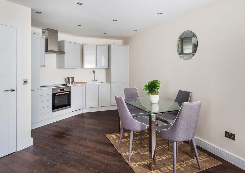 SPECIFICATIONS S Modern designed kitchens in gloss grey colour with flush unit doors and drawers, fitted with soft close mechanism Carrera Quartz worktops All the apartments include quality Bosch
