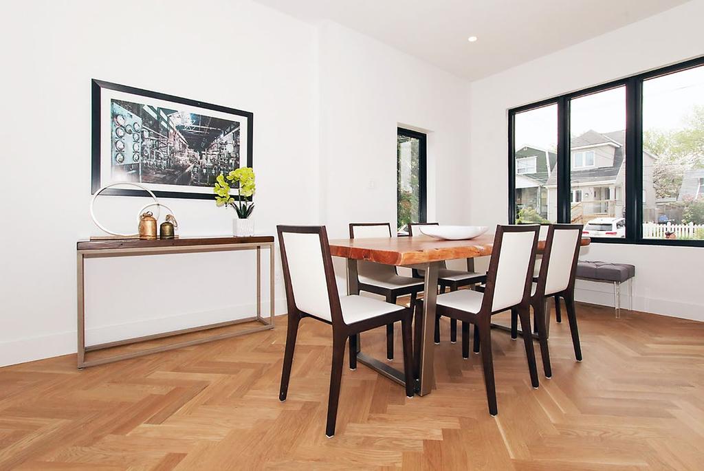 TOP The dining room shows off the attractive herringbone pattern of the hardwood flooring.
