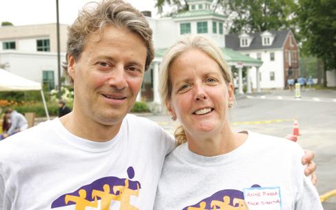 Volunteers Larry and anne Piazza of Blue Hill pose for a photo at the Blue Hill Memorial Hospital fun Run.