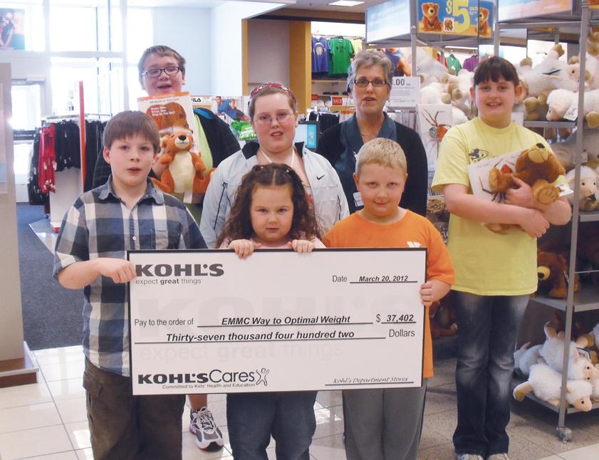 Kohl s jewelry supervisor Nancy Gilley (back row, second from right) presents a check to WOW participants (front row) Michael Gallant, Gracie Cutchins, Camden Andrick, (back row) Kollin Cobb, Ellie