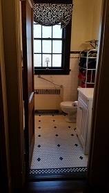 Other 2 full bathrooms on 2 nd floor Bathroom with original black and white tile, all original white subway tile walls.