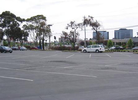 The Plan Area is currently occupied by retail and office uses, including Kmart, offices, Michaels, a Shell gas station, and their surface parking areas.