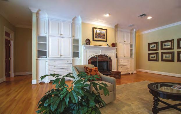 Ceilings Scenic Arched Windows with Plantation Shutters High Quality Wood Floors Two Ornate Stair Cases to