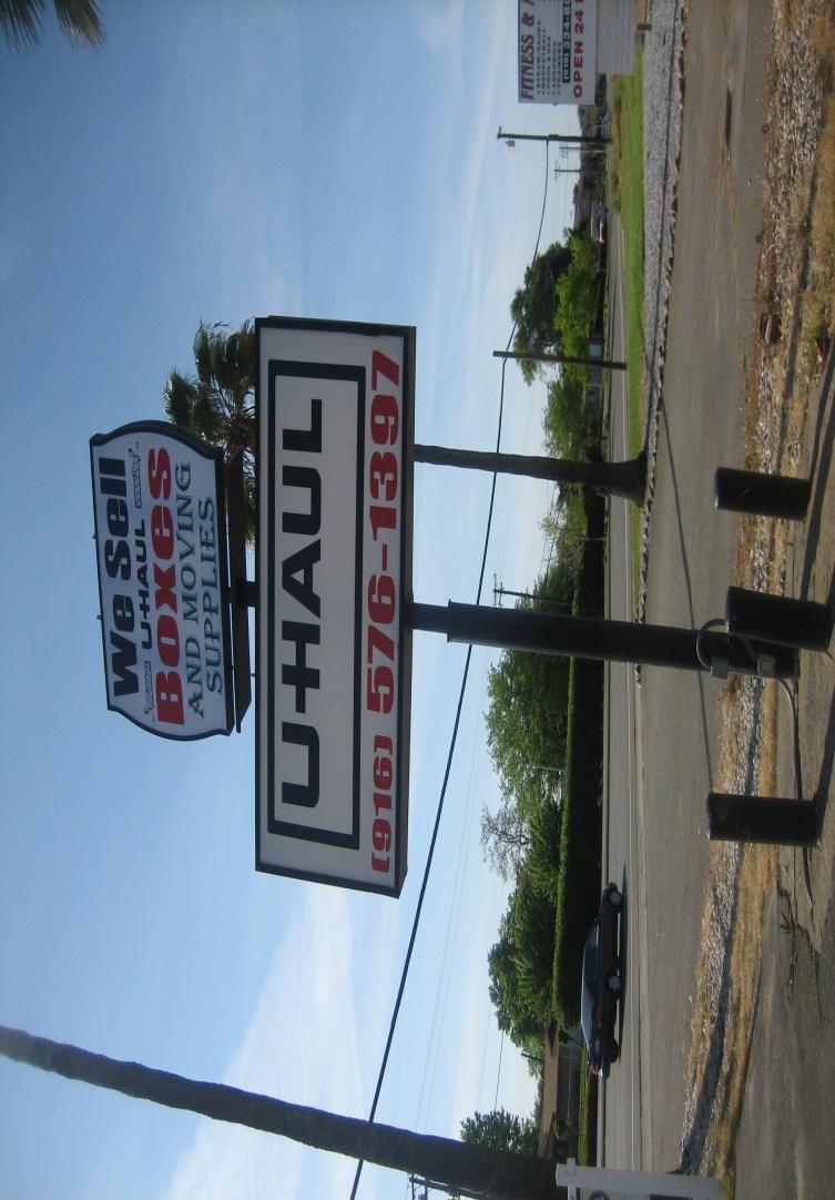 1. Photo of existing signage on the property for the U-Haul business with the landscaped planter and parking lot