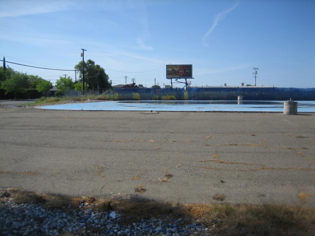 1. Photo of the adjacent southerly property which is currently vacant. Direction of the photo is toward the south. 2.