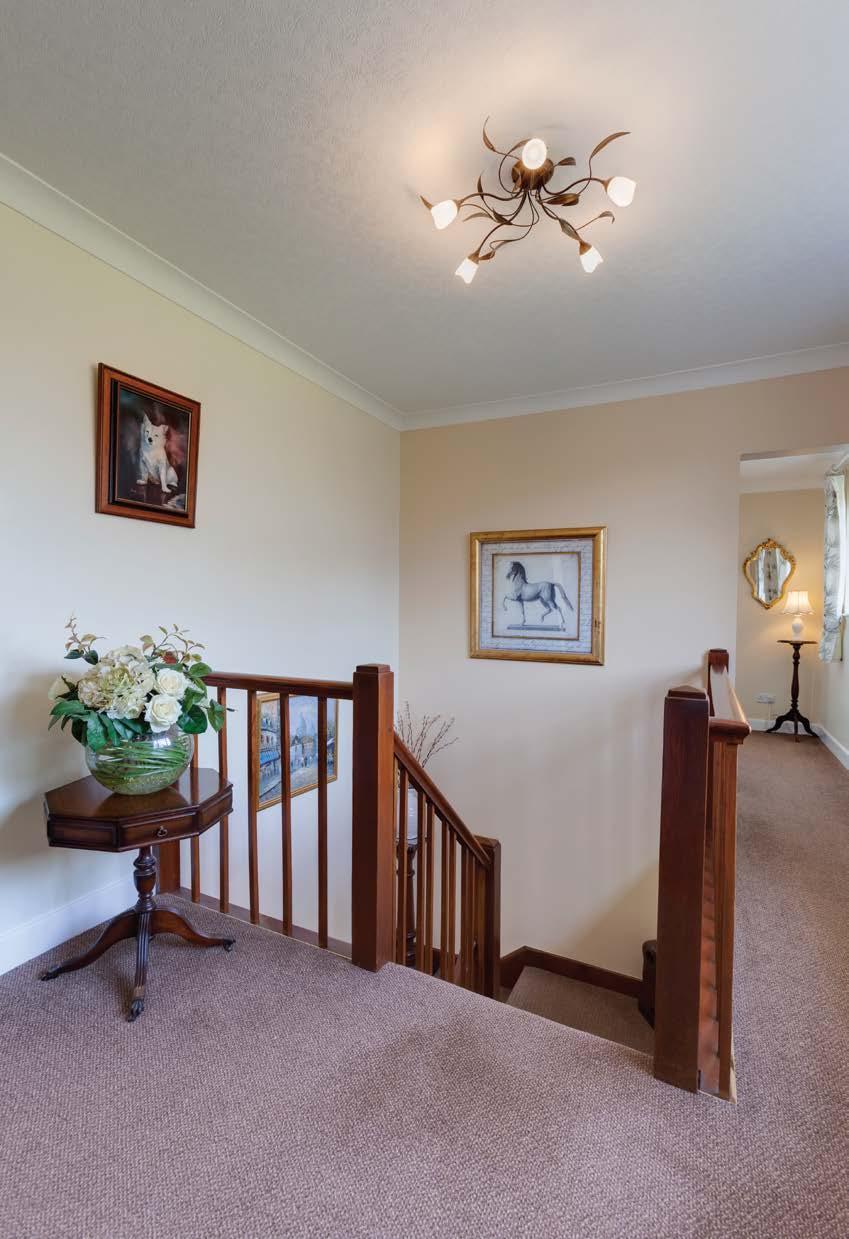 Whinleys Extended and Renovated to Provide Extensive Accommodation From the entrance hallway, a staircase with a useful under stairs storage cupboard, timber spindles and a handrail rises to the