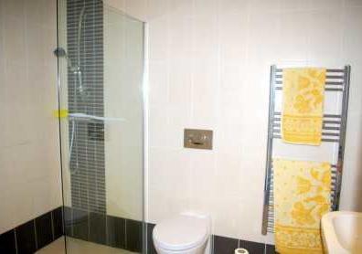 69m (8'11" x 5'7") Fully Tiled, shower area with half screen, pedestal wash hand
