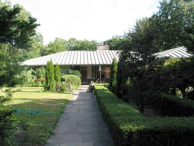 north view of L-shape house with landscaped forecourt