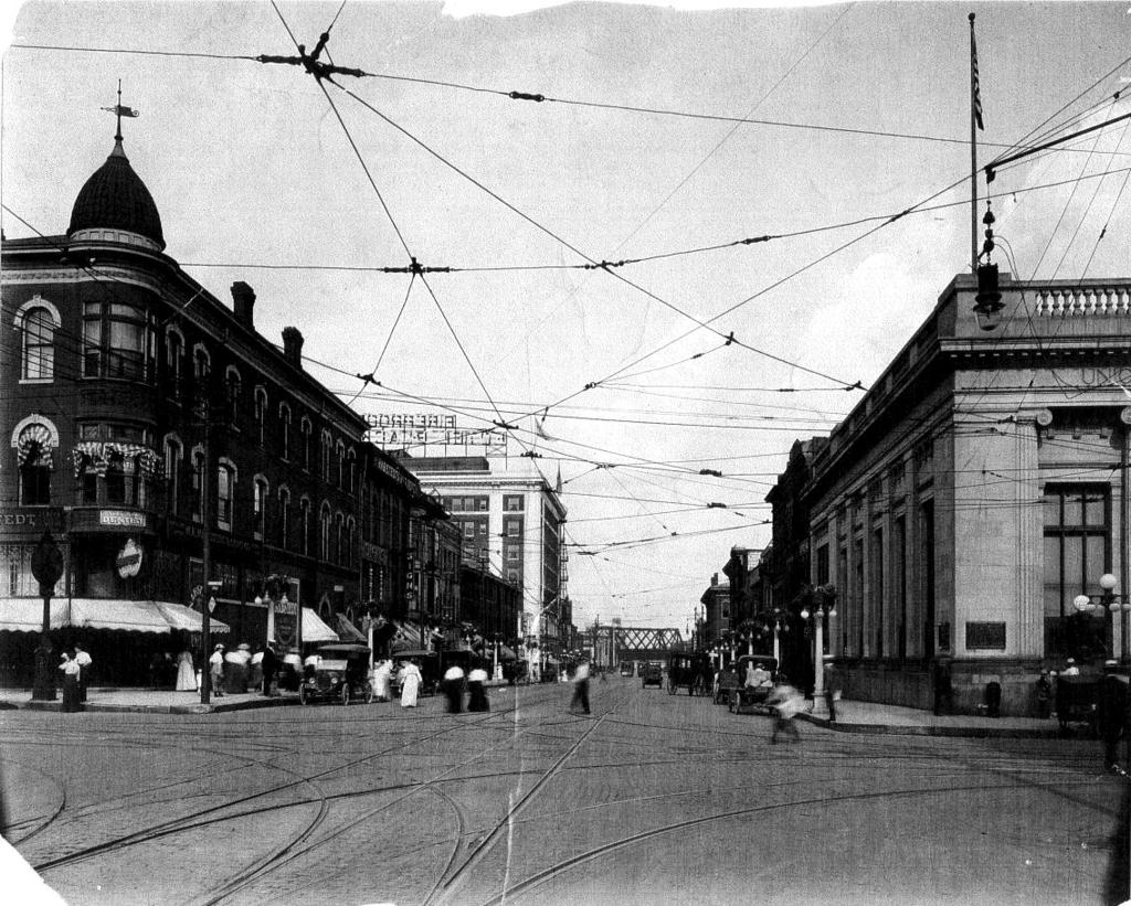 Page 12 This c.1915 streetscape of 3 rd Street, looking east from Brady Street, shows the site (turreted building at left) of the present Mississippi Hotel/RKO Theatre.
