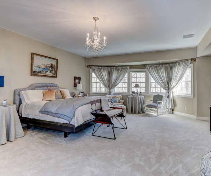 The Master bedroom suite occupies an entire wing of the second