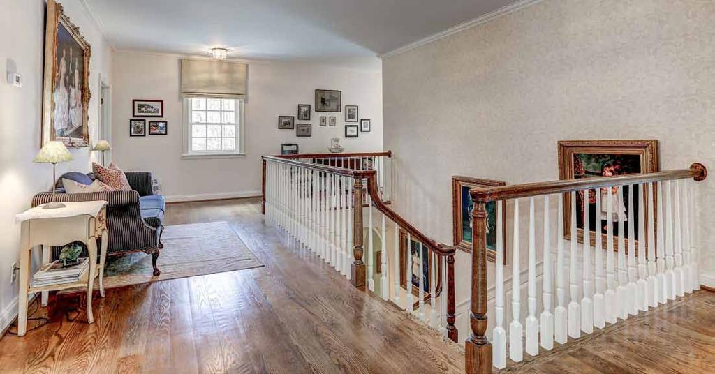 The gracious second floor landing features plentiful wall space