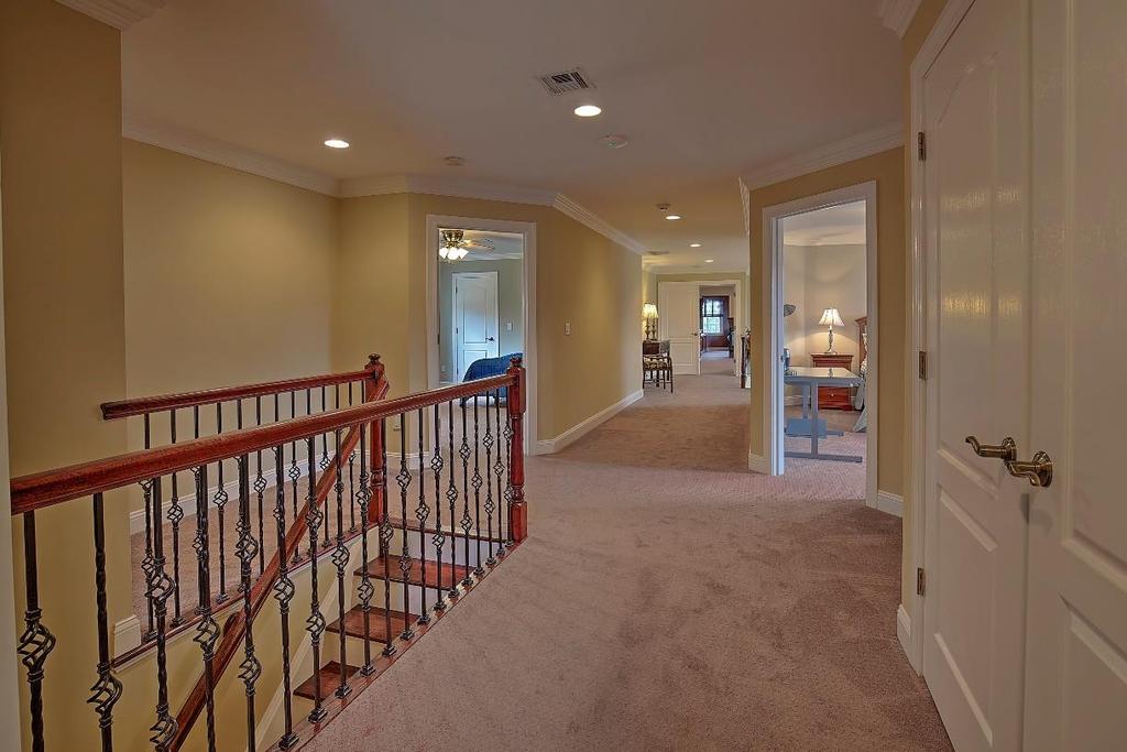 The second floor hall boasts custom upgraded carpet installed in 2010,