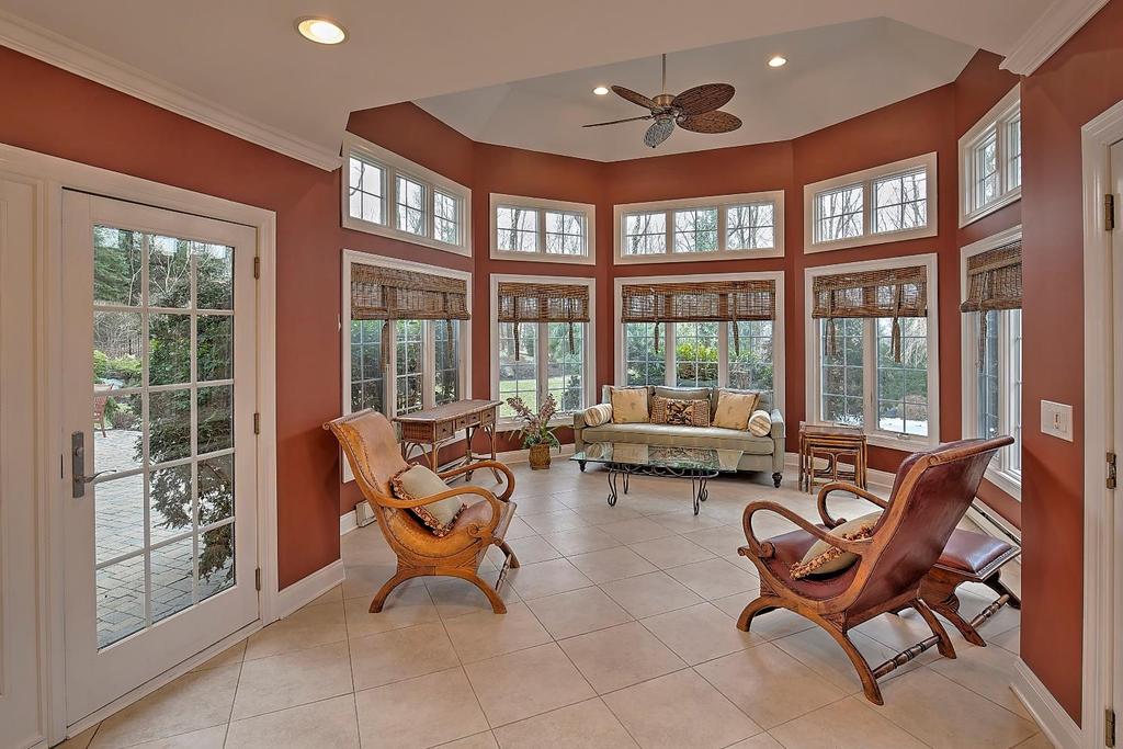 Sunroom 20 x 15: Step down from the Kitchen into this fabulous Sunroom with two sets of French doors that lead to the pool and paver patios.