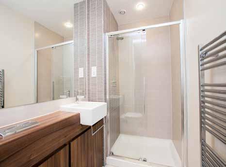 ENSUITE SHOWER ROOM: Contemporary white suite comprising, fully tiled double shower cubicle with