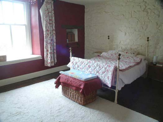 Doors to garden. Cupboard under stairs. Old meat hooks in ceiling. Telephone point. Stairs up to Main bedroom 3.78 x 5.