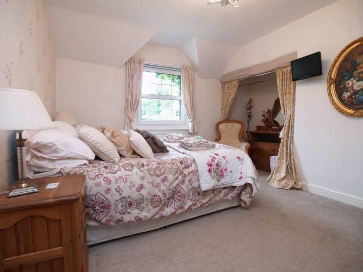 Boiler Room - With gas fired boiler - providing central heating and hot water. Double glazed window to rear. First Floor Landing Area - Providing access to the bedrooms. Brecon Room - 13'5" (4.