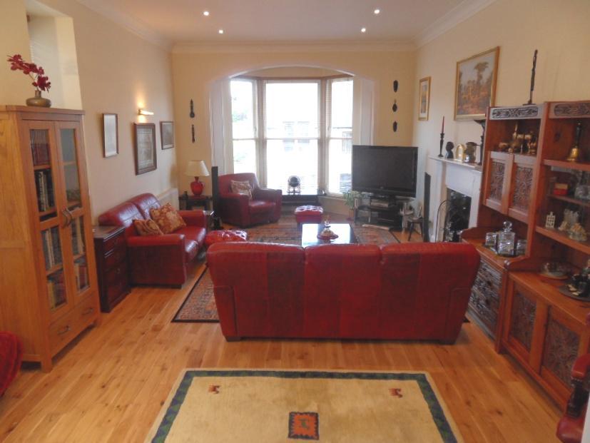 Lounge: Approx. 24 11(measured into bay window)x13 10. Spacious and most impressive public room with feature double glazed bay window looking to front of property.