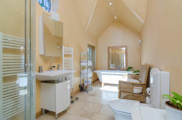 modern wash hand basin, low flush wc, corner shower cubicle with pressurised shower unit,