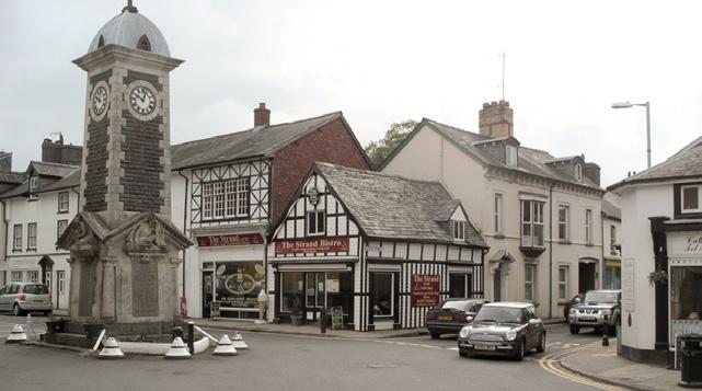 detached two storey former bank property that has been extended and converted for retail
