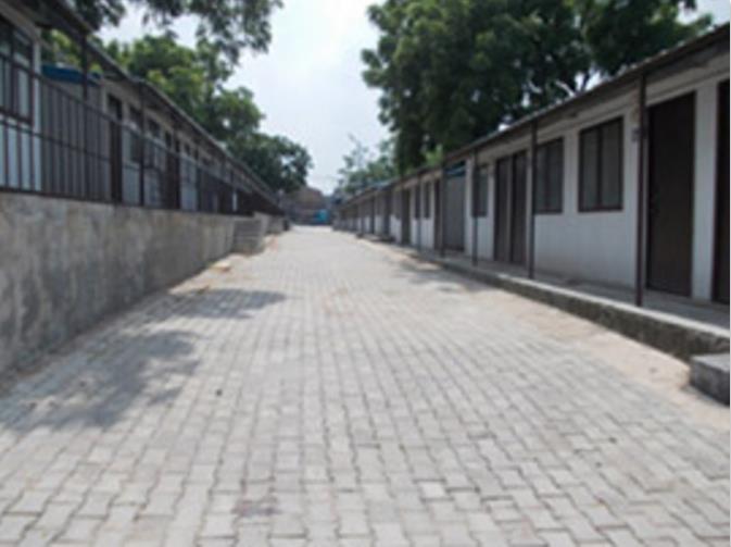 TRANSIT CAMP LOCATION : Anand parbat was chosen as the spot for relocation in march 2011, around five kilometers from the original settlement The transit camp itself is situated on an empty DDA plot