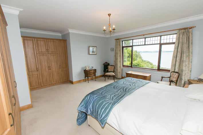 BEDROOM (2): 14 11 x 13 5 (4.55m x 4.09m) Panoramic view over Belfast Lough and surrounding gardens.