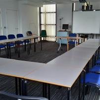 Third floor classrooms are linked by an open plan meeting area, with kitchen and vending machines.