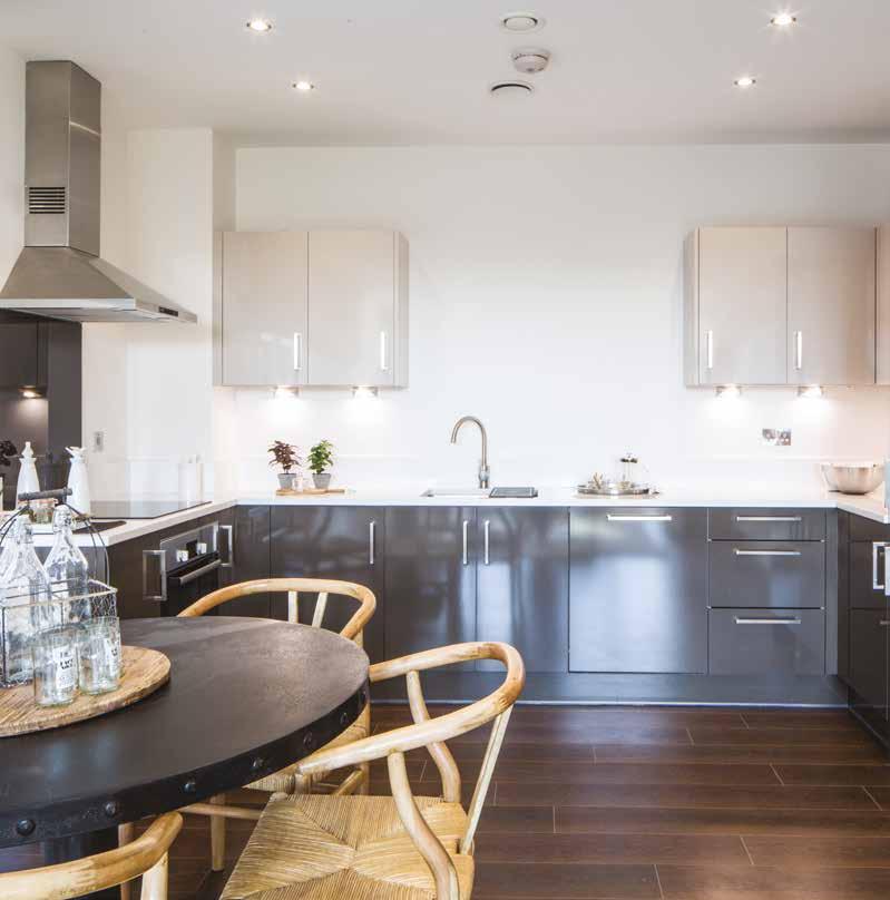 standard apartment specification kitchen dining living rooms Kitchens by Manhattan featuring soft-closing wall units in Cashmere and softclosing base units in Gloss Brown, quartz surface worktop in