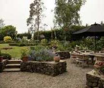 pond with additional flagged seating area; summerhouse and