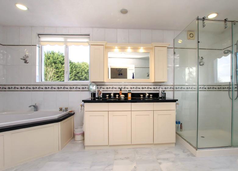 The utility room is directly adjacent the kitchen, comprising eye and base level units, a range of work surfaces, one and a half bowl sink unit, plumbing and space for an automatic washing machine