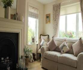 dual aspect windows, open fireplace with cream