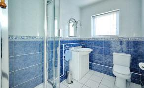 flush wc, heated towel rail, fully tiled walls, ceramic tiled floor, extractor fan.