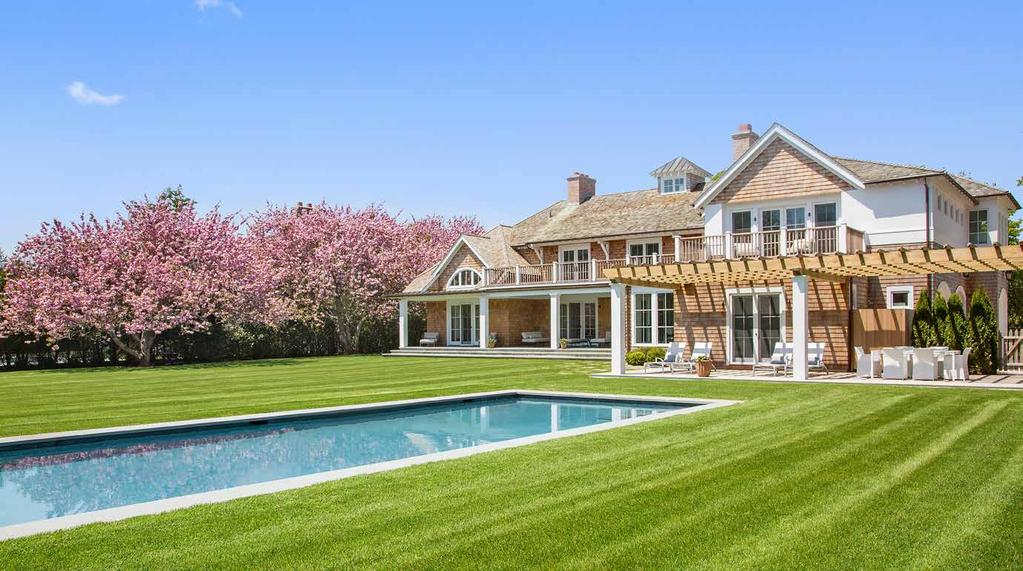 The sprawling lawn is accented by a 16'x 50' heated gunite pool, while the property has already been